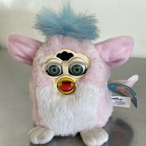 Furby Baby. ***battery compartment has one corroded terminal with missing coil.